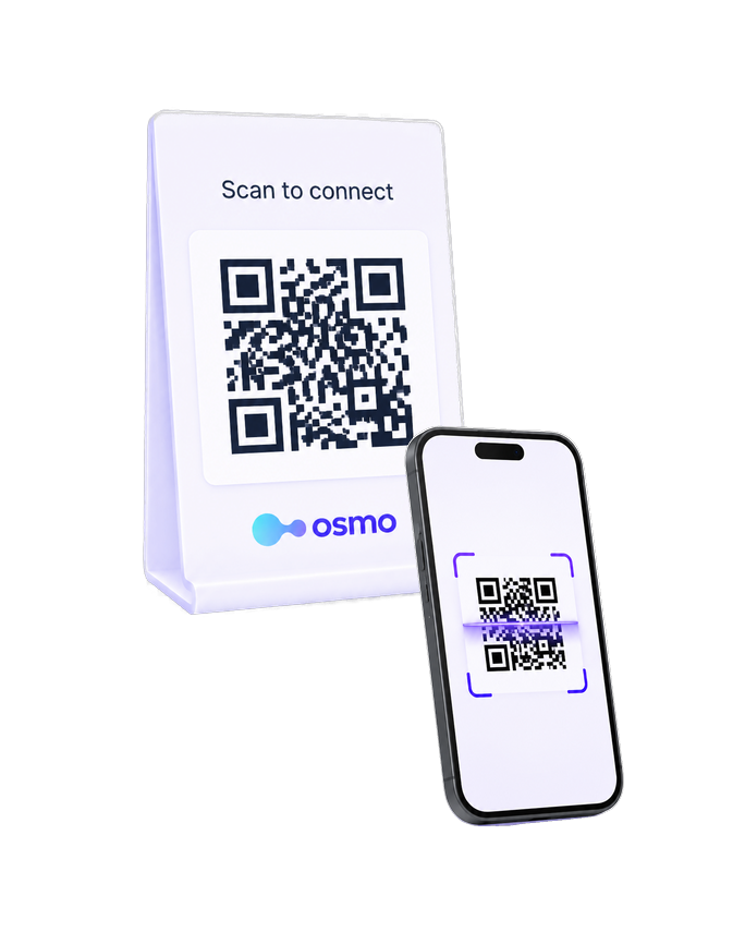 QR code stand with a phone scanning it